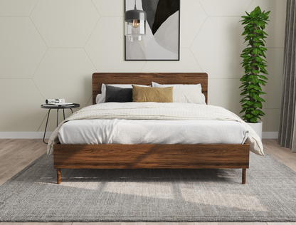 front view of a king bed frame with mattress and pillows in a bedroom from Isaak