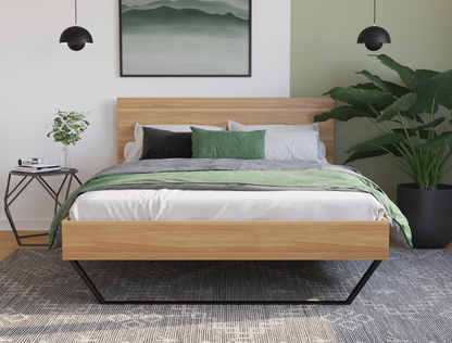 front view of a double bed frame with mattress and pillows in a bedroom from Isaak