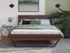 front view of a king single bed frame with mattress and pillows in a bedroom from Isaak