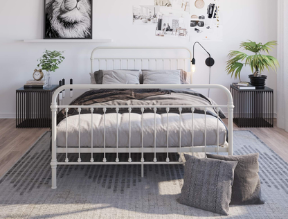 front view of a queen bed frame with mattress and pillows in a bedroom from Isaak