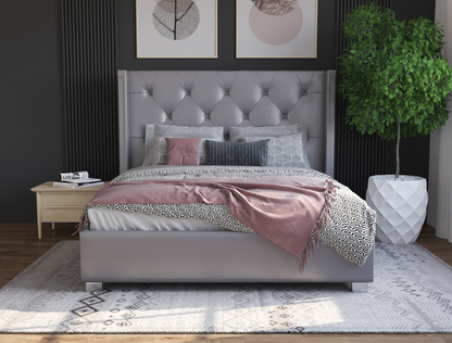 front view of a king bed frame with mattress and pillows in a bedroom from Isaak