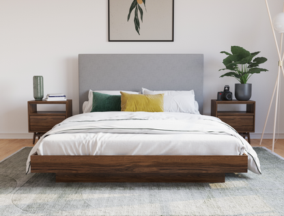 front view of a queen bed frame with mattress and pillows in a bedroom from Isaak