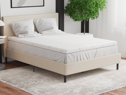 top view of a double mattress topper with two pillows on a bed frame in a bedroom from Isaak