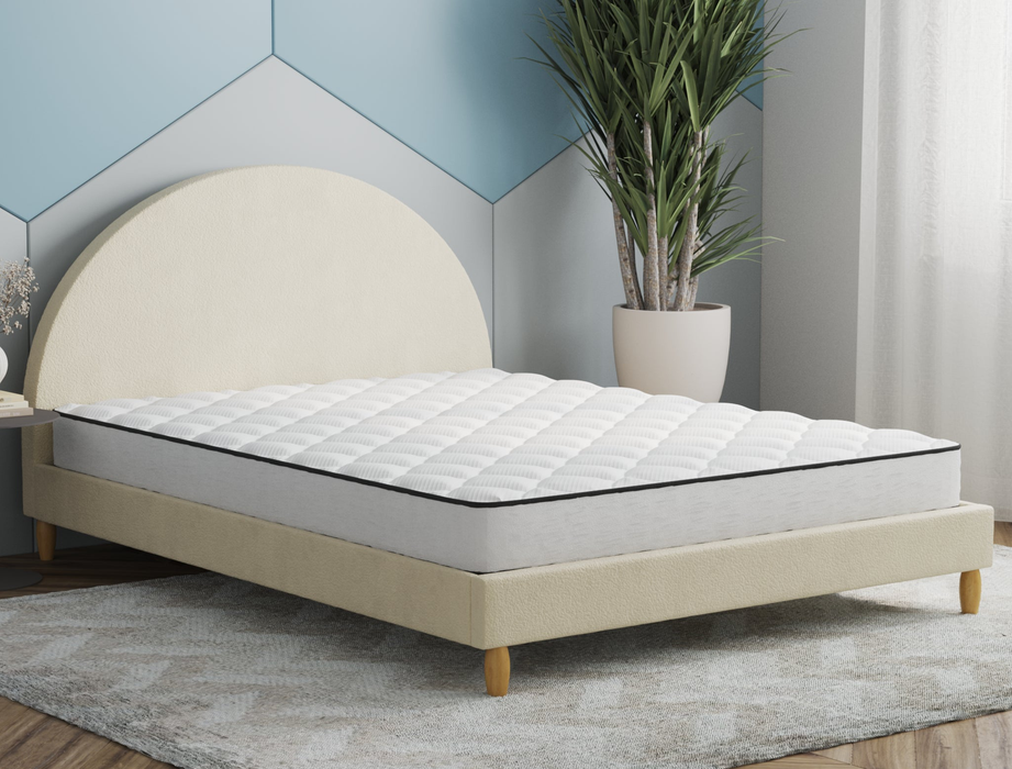 side view of a double mattress on a bed frame in a bedroom from Isaak