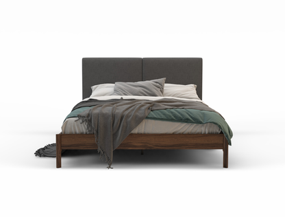 front view of a king bed frame with mattress and pillows in a white background from Isaak