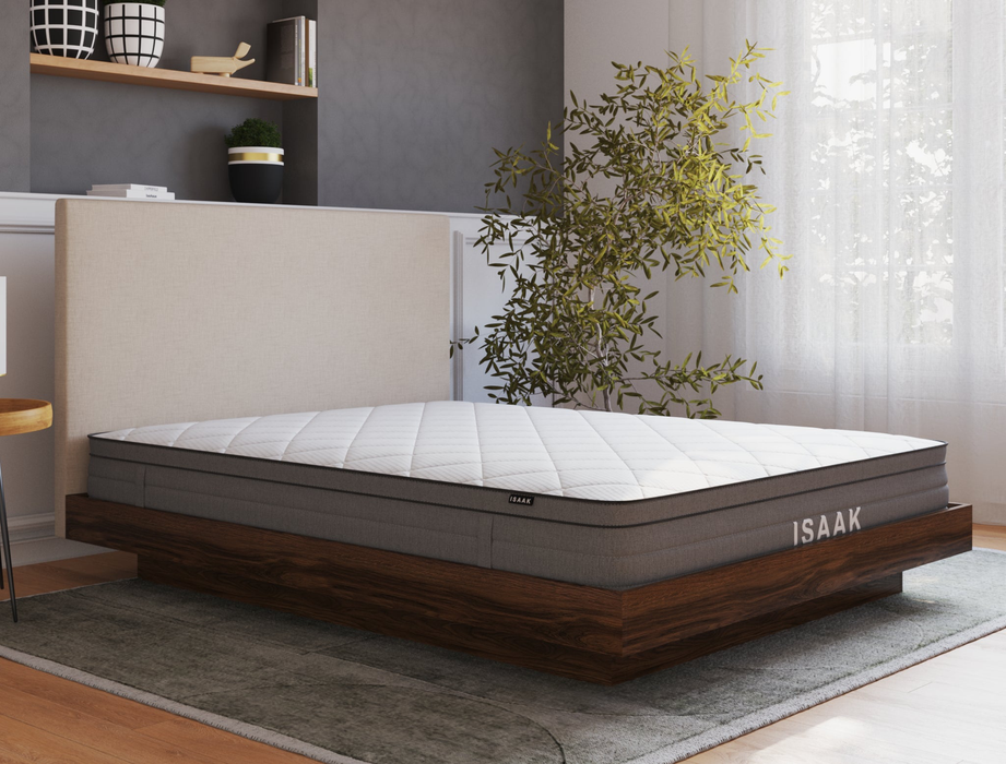 side view of a king mattress on a bedframe in a bedroom from Isaak