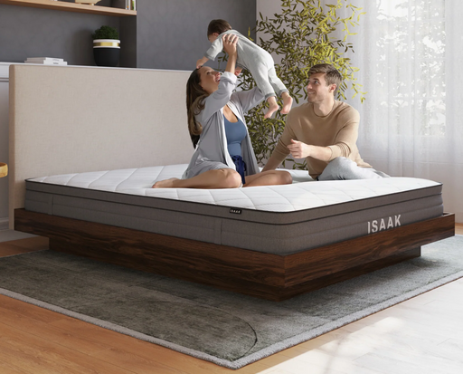 mom and dad playing with a kid on a single mattress on a bed frame in a bedroom from Isaak