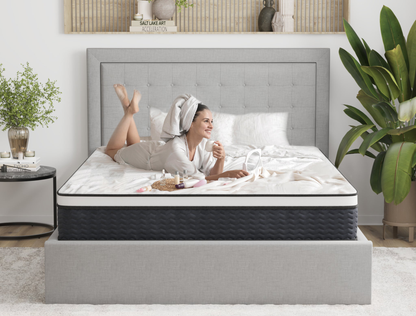 woman laying on a double mattress on a bed frame in a bedroom from Isaak