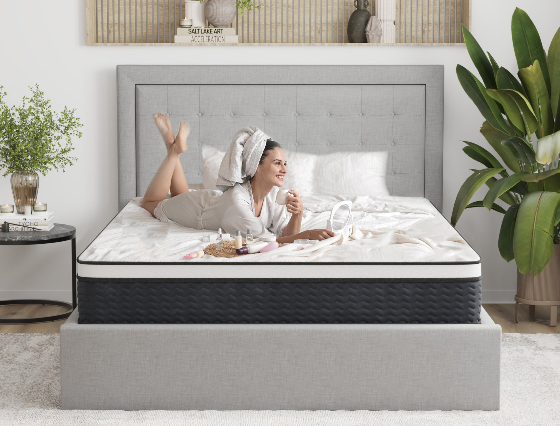 woman laying on a queen mattress on a bed frame in a bedroom from Isaak