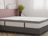 side view of a double mattress on a bed frame in a bedroom from Isaak