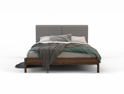 front view of a king bed frame with mattress and pillows in a white background from Isaak