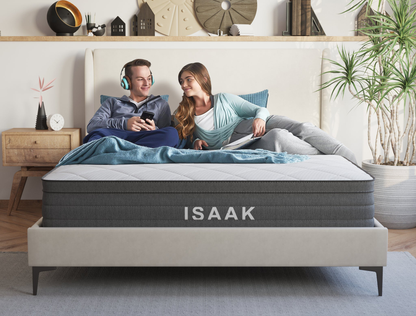 couple laying on a double mattress on a bed frame in a bedroom from Isaak