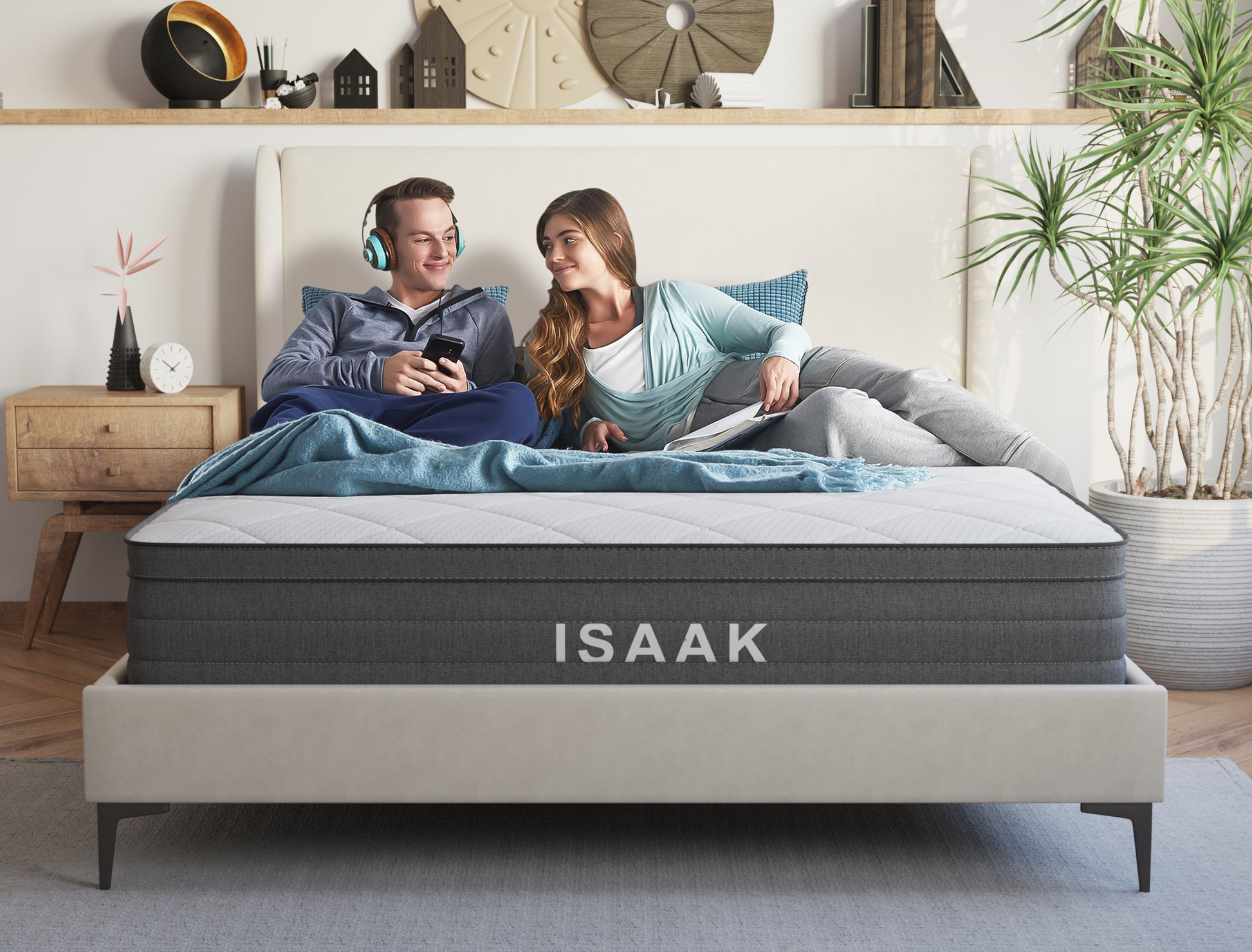 couple laying on a king mattress on a bed frame in a bedroom by Isaak