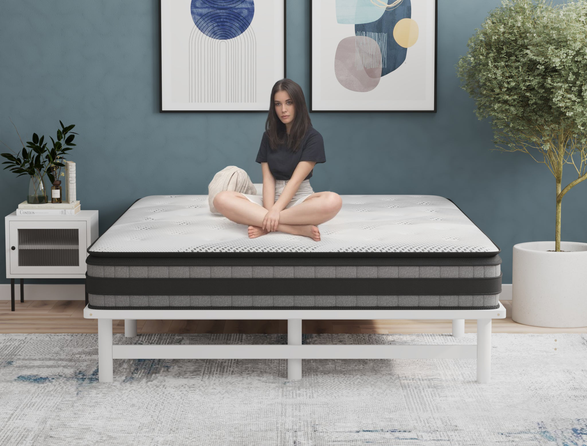 woman sitting on a double mattress on a bed frame in a bedroom from Isaak