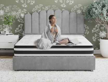 woman sitting on a double mattress on a bed frame in a bedroom from Isaak