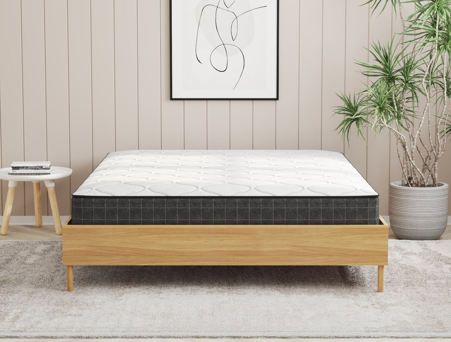 front view of a double mattress in a bed frame in a bedroom from Isaak