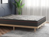 side view of a double mattress on a bed frame in a bedroom from Isaak 2