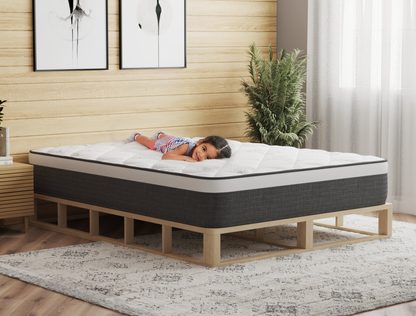 kid laying on a double mattress on a bed frame in a bedroom from Isaak