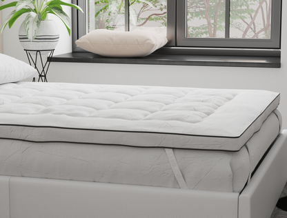 side view of a double mattress topper on a bed frame in a bedroom from Isaak