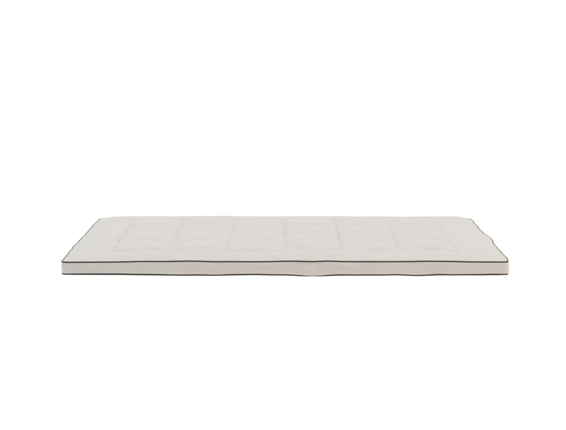 side view of a double mattress topper in a white background from Isaak