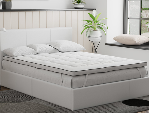 top view of a queen mattress topper with three pillows on a bed frame in a bedroom from Isaak