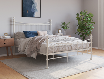 top view of a king bed frame with mattress and pillows in a bedroom from Isaak