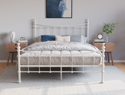 front view of a queen bed frame with mattress and pillows in a bedroom from Isaak