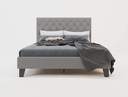 front view of a double bed frame with mattress and pillows in a white background from Isaak