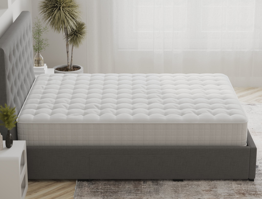 side view of a king mattress on a bed frame in a bedroom