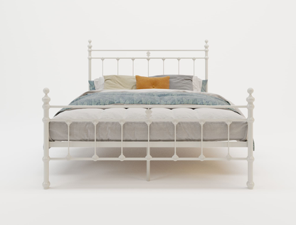 front view of a double bed frame with mattress and pillows in a white background from Isaak